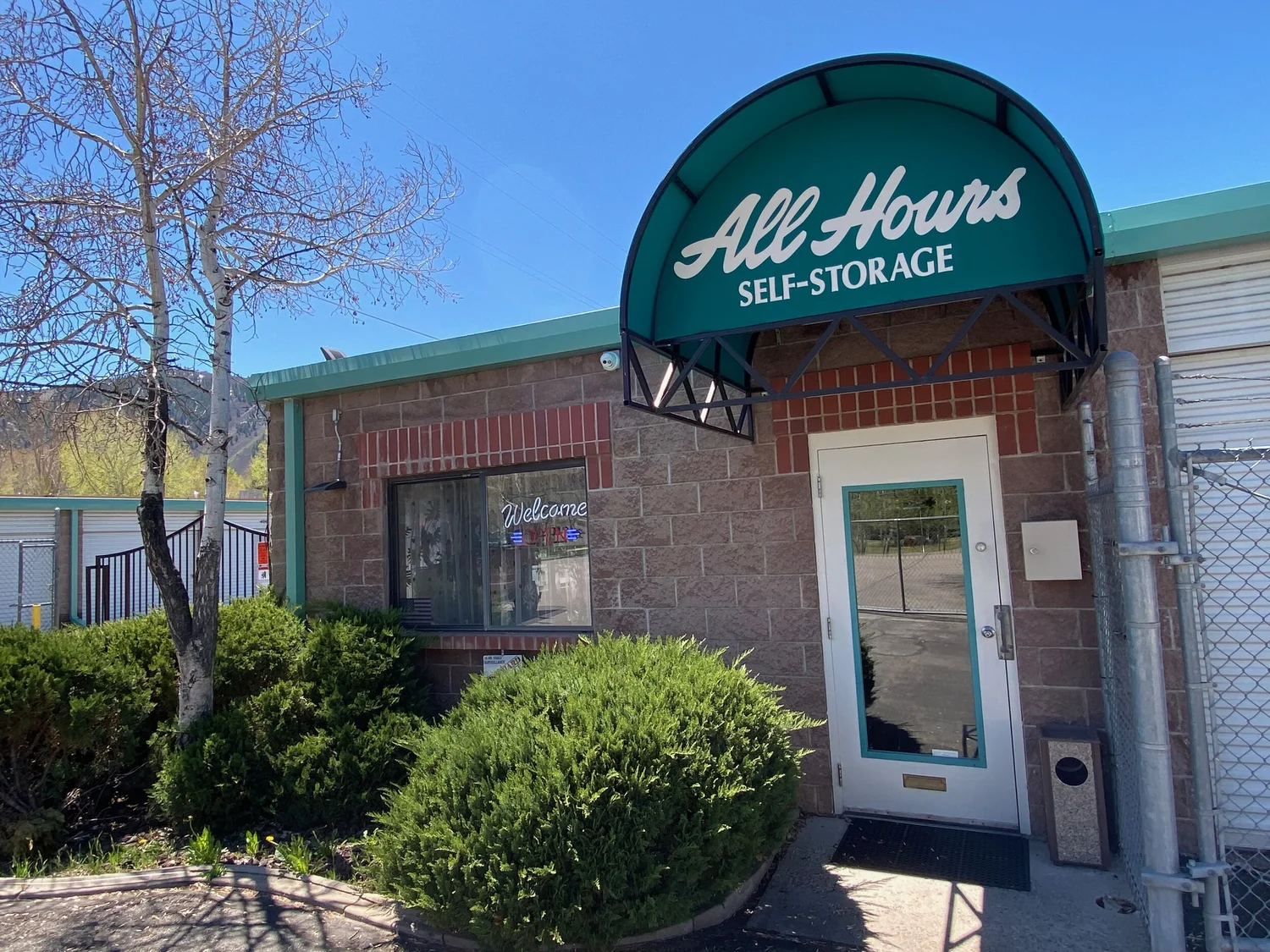All Hours Self Storage office entrance with its green awning in Basalt, Colorado